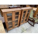 A PAIR OF MODERN PINE GLAZED BOOKCASES, EACH BEING 27.5" WIDE