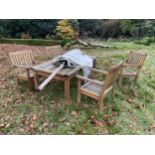 A TEAK GARDEN FURNITURE SET WITH TABLE, FOUR CHAIRS AND PARASOL