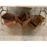 FIVE WICKER BASKETS, A PICNIC BASKET AND A SMALL LEATHER SUITCASE