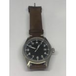 A SWISS CALENDER WRIST WATCH SEEN WORKING BUT NO WARRANTY