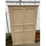 A LARGE TWO DOOR PITCH PINE VICTORIAN PANELLED STORAGE CUPBOARD, 50" WIDE