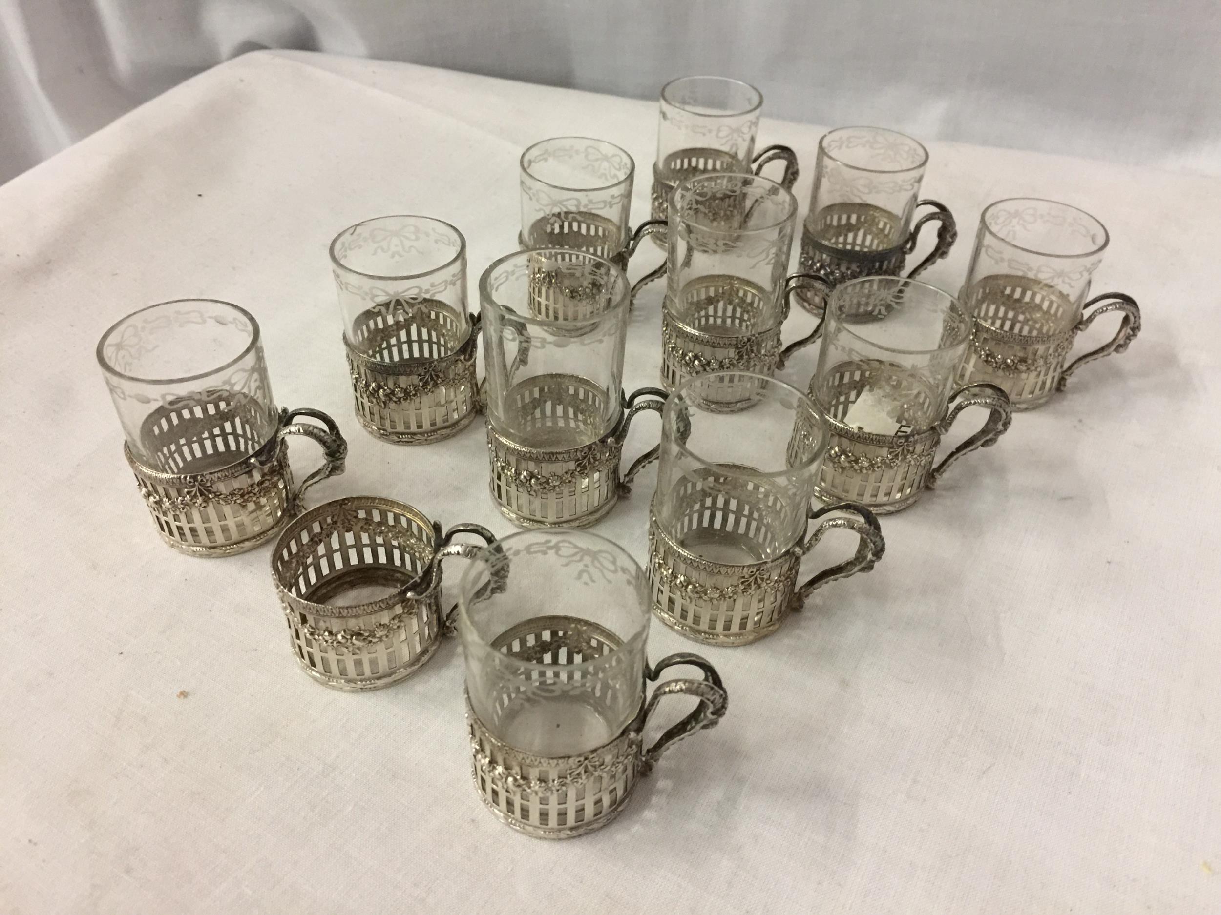 A SET OF TWELVE MARKED 925 SILVER STIRRUP CUP HOLDERS WITH GLASSES (ONE NO GLASS)