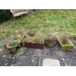 AN ASSORTMENT OF GARDEN PLANTERS TO INCLUDE THREE SALT GLAZED TROUGHS AND FIVE TERRACOTTA EXAMPLES