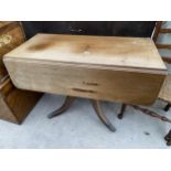 A VICTORIAN MAHOGANY PEMBROKE TABLE ON QUATREFOIL BASE