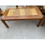 A RETRO TEAK COFFEE TABLE WITH INSET TILED TOP, STAMPED MADE IN DENMARK, 39 X 20.5"