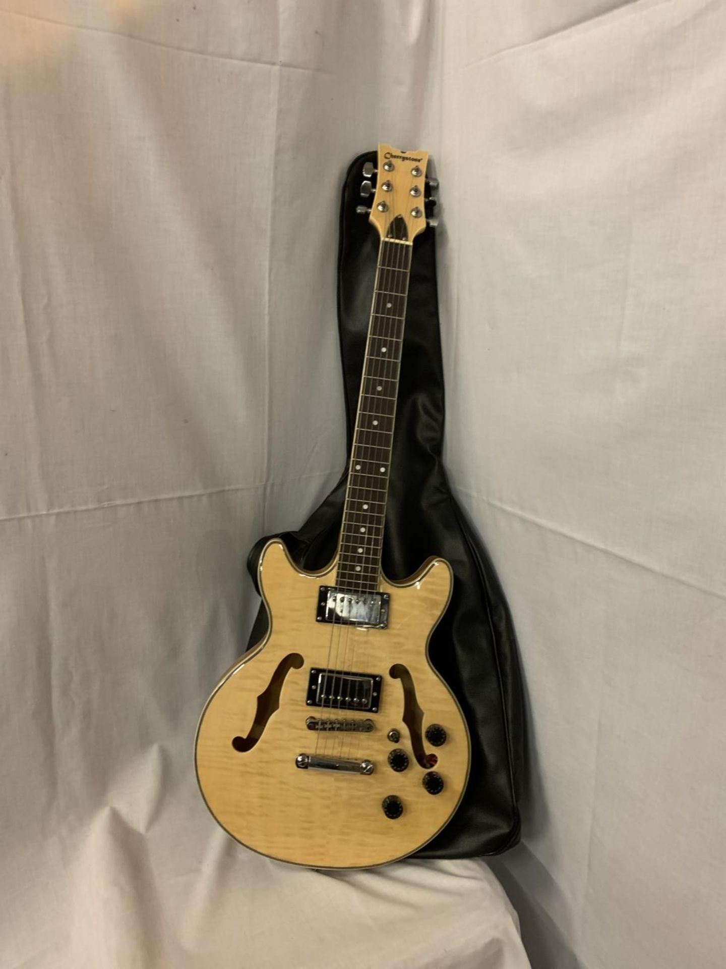 A CHERRYSTONE ELECTRO ACCOUSTIC GUITAR WITH CASE