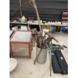 A LARGE ASSORTMENT OF GARDEN TOOLS TO INCLUDE A VINTAGE SYTHE, AXES AND PICK AXES ETC