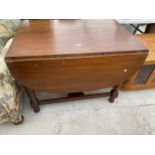 A MODERN MAHOGANY GATELEG TABLE ON TURNED LEGS