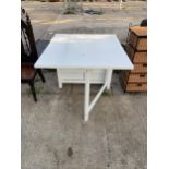 A MODERN WHITE DROP-LEAF KITCHEN TABLE