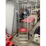 A SMALL METAL CABINET AND A TWO SHOP RACKS