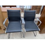 A PAIR OF EAMES STYLE CHROME FRAMED ELBOW CHAIRS