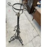 A TALL DECORATIVE WROUGHT IRON LAMP BASE