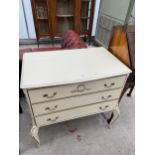 A MODERN THREE DRAWER CREAM AND GILT CHEST, 31" WIDE