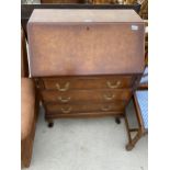 A REPRODUCTION WALNUT AND MAHOGANY CROSSBANDED BUREAU ON CABRIOLE LEGS, 29.5" WIDE