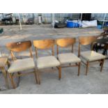 A SET OF FOUR RETRO TEAK DINING CHAIRS