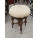 A VICTORIAN REVOLVING PIANO STOOL