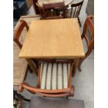 A MODERN DRAW-LEAF DINING TABLE AND FOUR CHAIRS