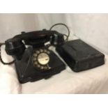 A VINTAGE ROTARY DIAL BLACK BAKELITE G.P.O. TELEPHONE 1/232CB FWR55/2 TOGETHER WITH WALL MOUNTED BOX