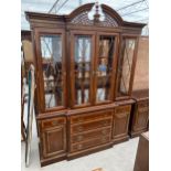 A GEORGIAN STYLE MAHOGANY AND CROSSBANDED BREAKFRONT BOOKCASE ON BASE WITH FOUR ASTRAGAL GLAZED