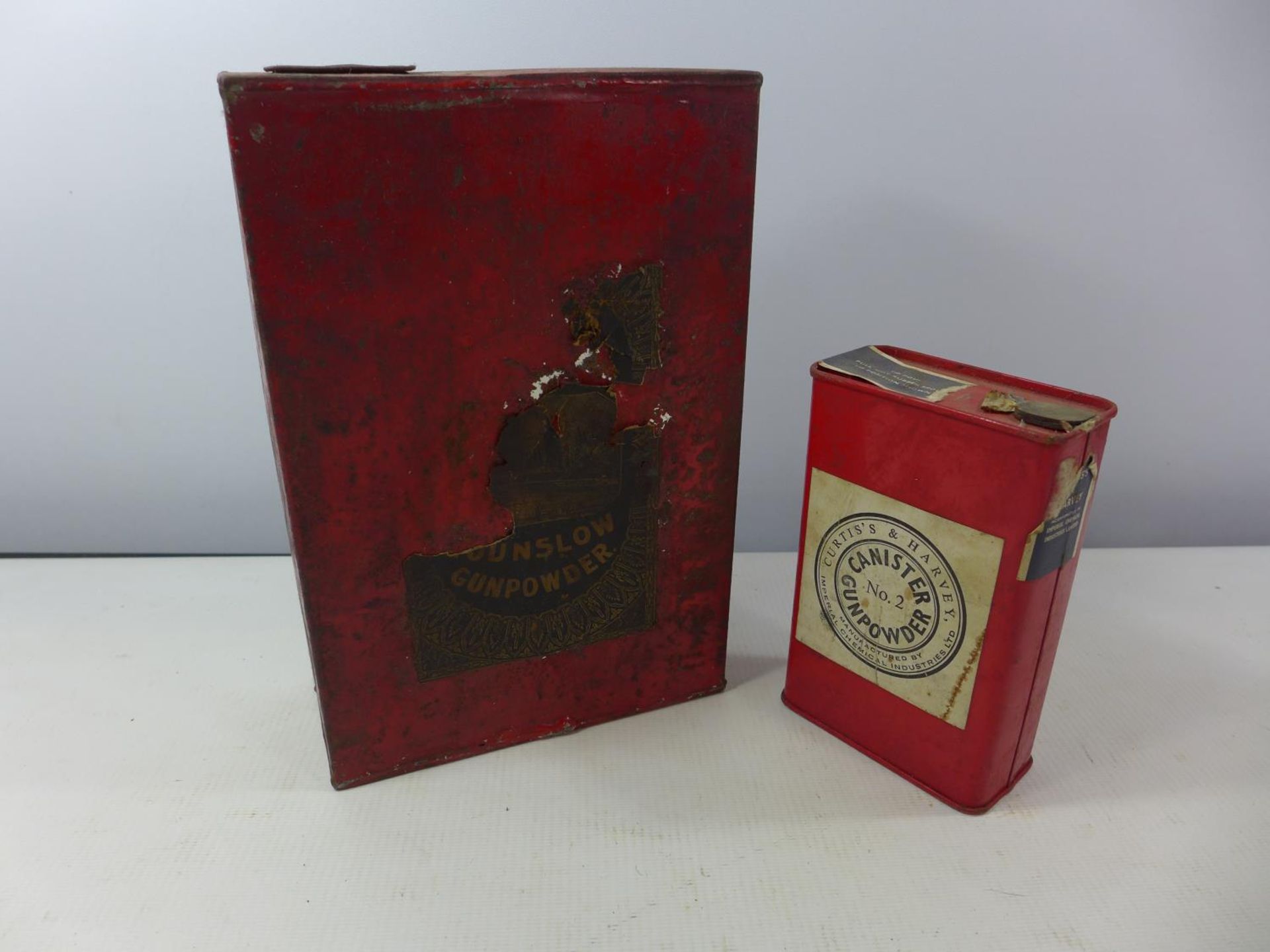 TWO RED PAINTED GUN POWDER TINS