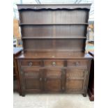 A REPRODUCTION OAK DRESSER COMPLETE WITH RACK, 54" WIDE