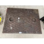 A CAST IRON MANHOLE COVER