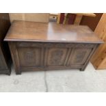 A GEORGIAN STYLE OAK BLANKET CHEST WITH CARVED THREE PANEL FRONT, 41" WIDE