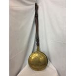 A BRASS BED WARMING PAN