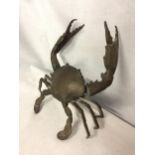 A POSSIBLY BRONZE RAISED CRAB ORNAMENT, ARM A/F