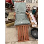 A TEAK RECLINING GARDEN CHAIR WITH CUSHION