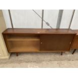 A RETRO TEAK STORAGE CABINET WITH TWO SLIDING DOORS, ONE BEING GLASS, 60" WIDE