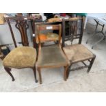 A RUSH SEATED COUNTRY CHAIR, AN EDWARDIAN DINING CHAIR AND A MAHOGANY ROPE BACK CHAIR