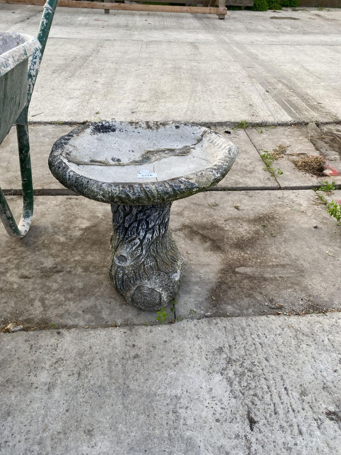 A SMALL STONE EFFECT BIRD BATH