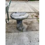 A SMALL STONE EFFECT BIRD BATH