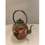 AN ORIENTAL POTTERY AND METAL TEAPOT DECORATED IN RED WITH YELLOW AND BLUE FLOWERS