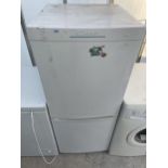 A WHITE CANDY UPRIGHT FRIDGE FREEZER