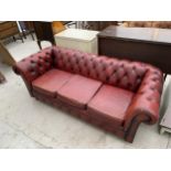 AN OXBLOOD CHESTERFIELD THREE SEATER SETTEE