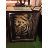 A FRAMED PAINTING ON BOARD OF A TIGER