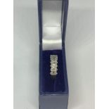 A 9 CARAT GOLD RING WITH IN LINE DIAMOND CHIPS SIZE J WITH A PRESENTATION BOX