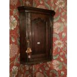 A GEORGIAN OAK WALL MOUNTED FLAT FRONT CORNER CUPBOARD