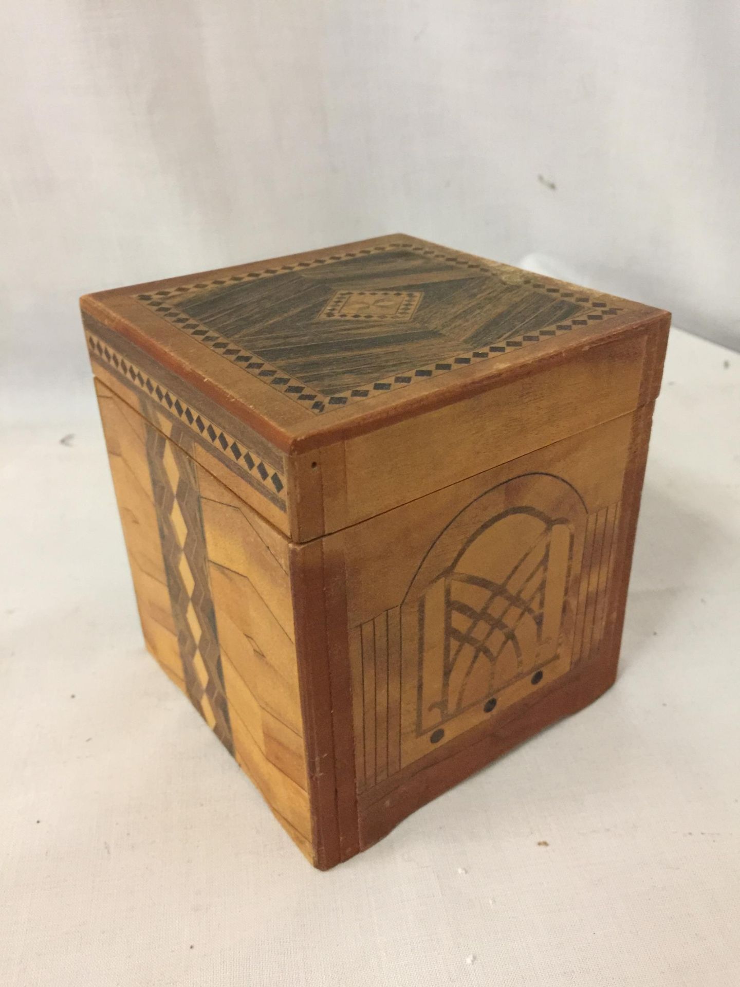 A MARQUETRY 'JACK IN THE BOX' WITH A TOUCAN STYLE WOODEN BIRD