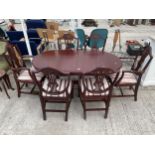 A REGENCY STYLE EXTENDING DINING TABLE AND SIX CHAIRS