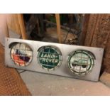 A LARGE LAND ROVER ILLUMINATED TRAFFIC LIGHT STYLE SIGN WITH HEADLIGHT DESIGN SIZE 36.5 INCHES/