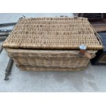 A LARGE WICKER HAMPER BASKET