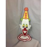 A WOODEN PAINTED CLOWNS HEAD
