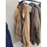 A MEDIUM MENS TIMBERLAND COAT AND A SHEEPSKIN JACKET