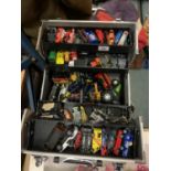 A METAL TOOL BOX FILLED WITH TOY CARS