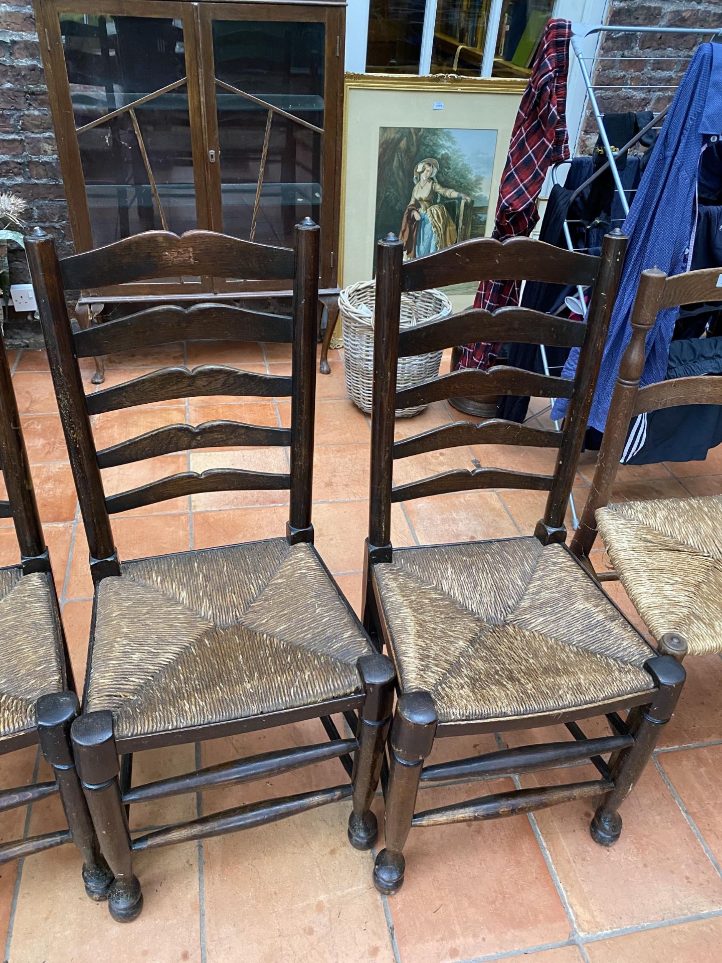 A SET OF FOUR LANCASHIRE STYLE OAK LADDER BACK DINING CHAIRS WITH RUSH SEATS - Image 3 of 4