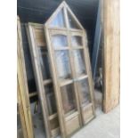 A WOODEN FRAMED GARDEN GREENHOUSE