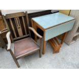 A 20TH CENTURY FORMICA TOP DROP-LEAF KITCHEN TABLE, PINE MAGAZINE RACK AND AN OAK ELBOW CHAIR